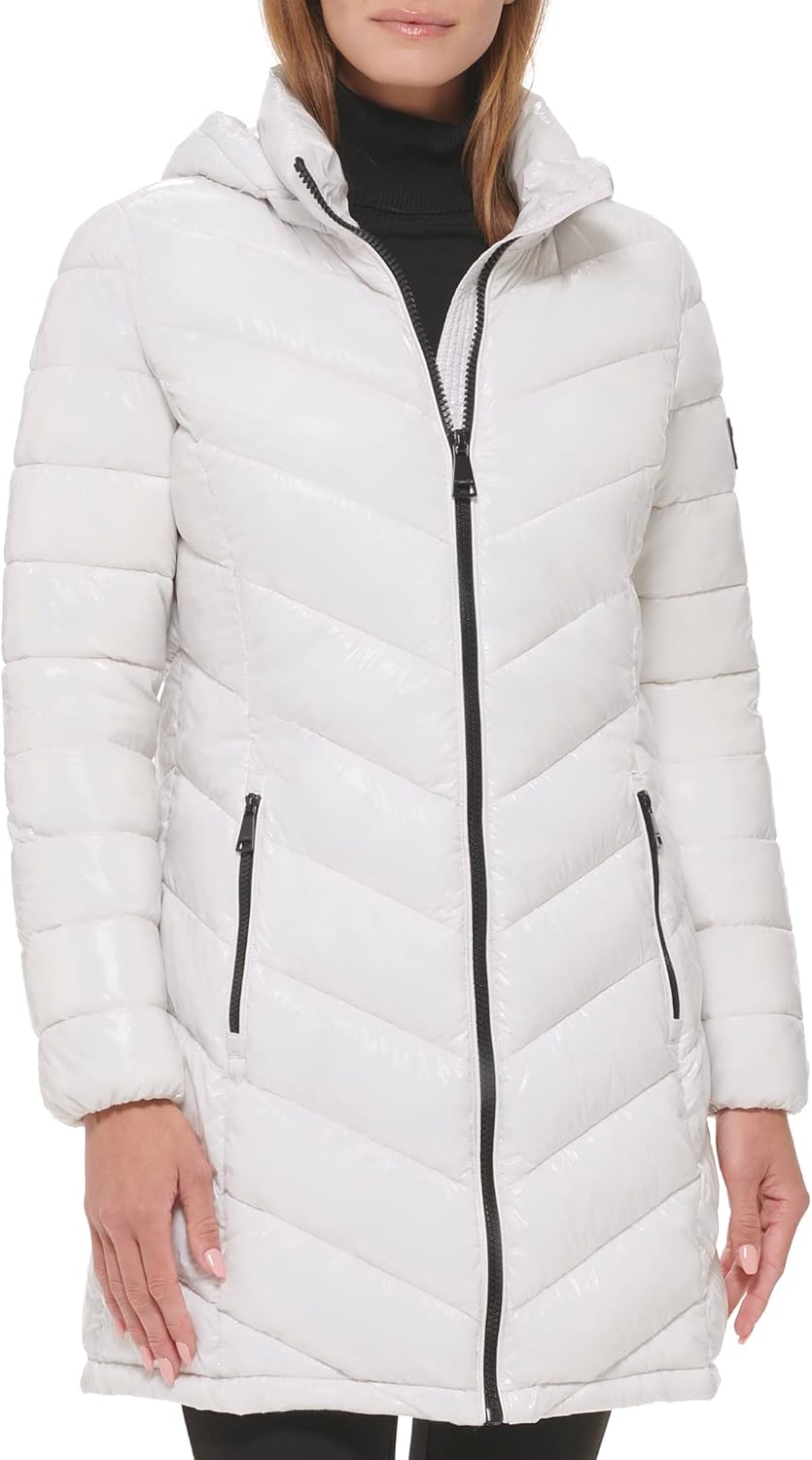 Women’s long puffer jacket in white with hood, center front zipper, and zip pockets