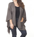 Slate gray knitted poncho cape with open front and draped sleeves, includes front pockets