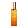 Honey Oud eau de parfum bottle, amber glass with gold cap, 20 ml