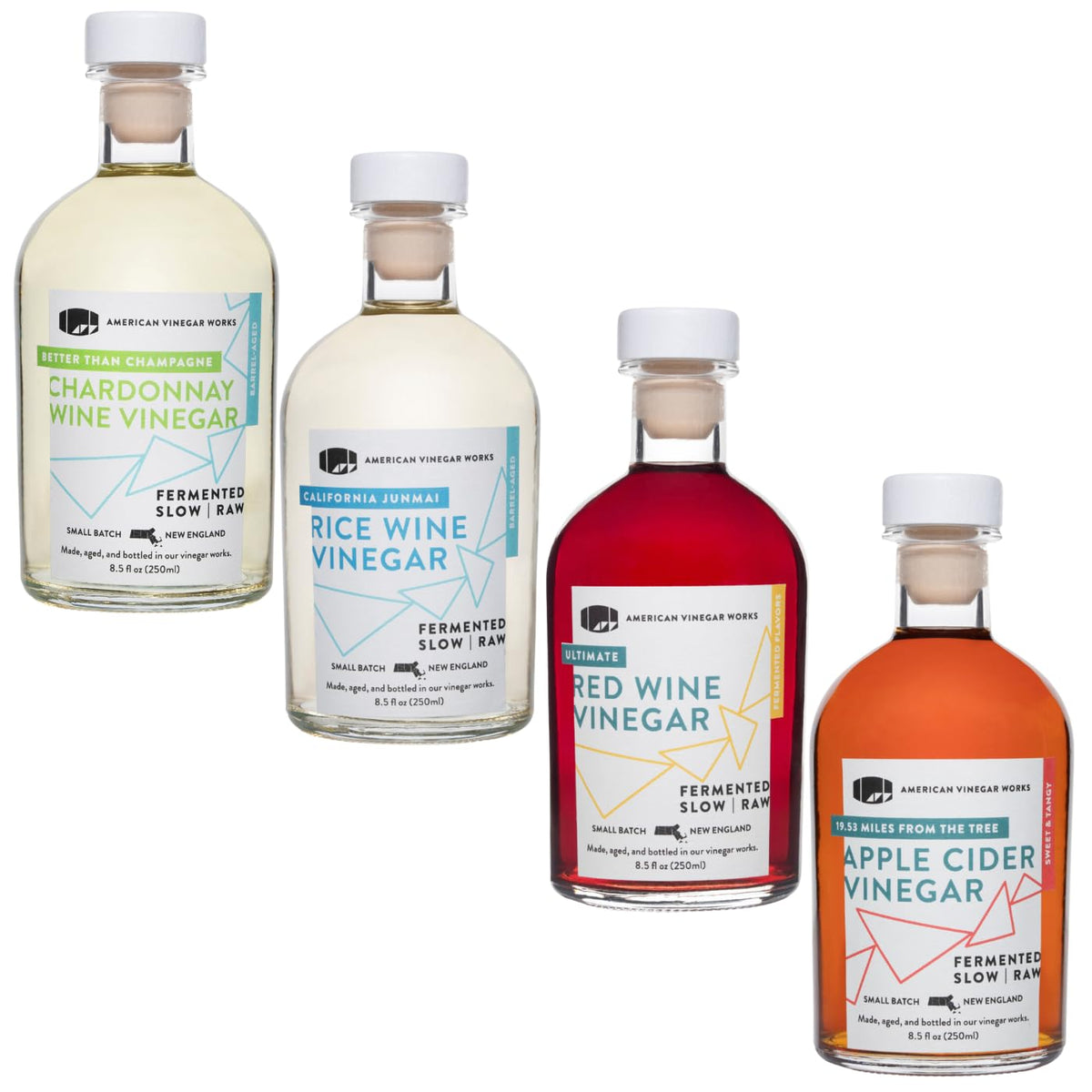 Four vinegar bottles on white: red, pale yellow, amber, and light gold labels.