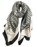 Black-and-light striped oblong scarf with wavy lines and soft fringed edges