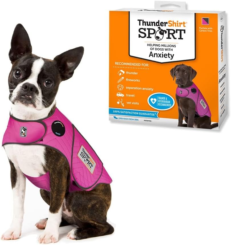 Fuchsia ThunderShirt calming vest on a seated dog beside its retail box