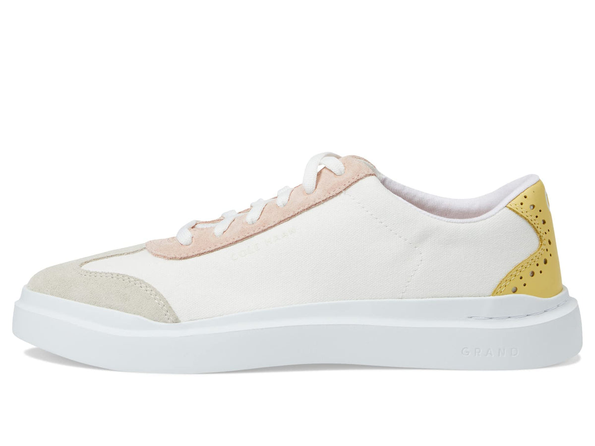 Women's canvas T-toe sneaker side view with white upper, blush laces and yellow heel