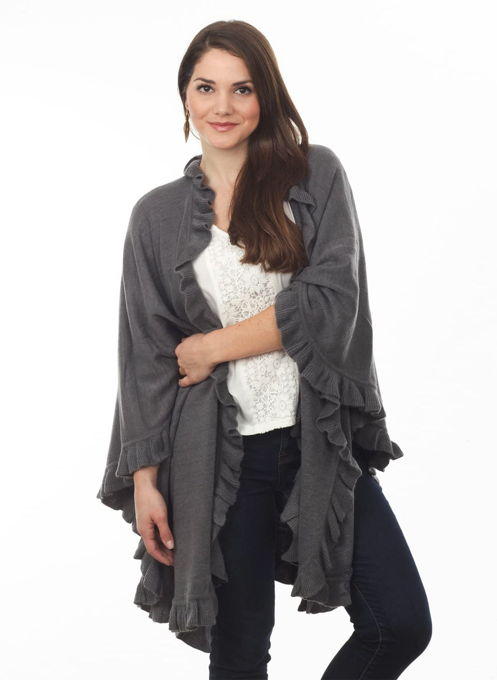 Slate gray knit poncho cape with open front and ruffle trim, draped over dark pants