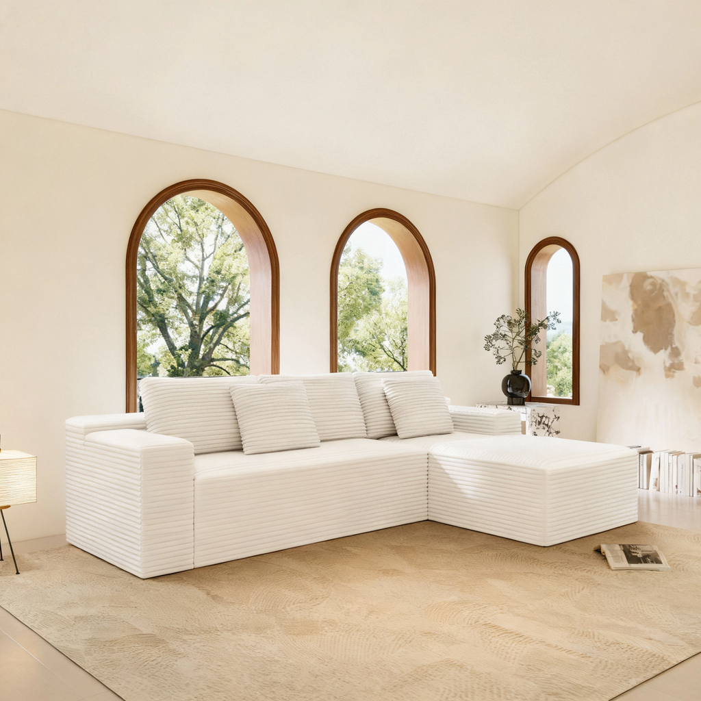 White modular sectional sofa seat with striped-texture upholstery, multiple back cushions