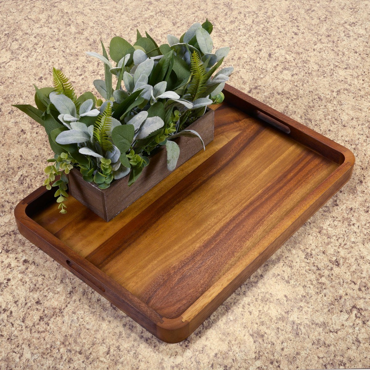 Brown wooden rectangular serving tray with solid bottom and built-in carrying handle