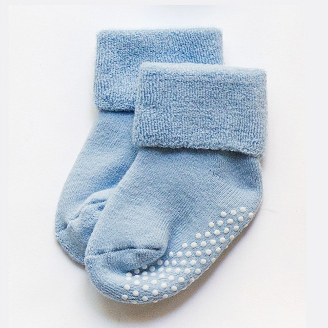 Light blue children non-slip socks with dotted grip on the sole and heel