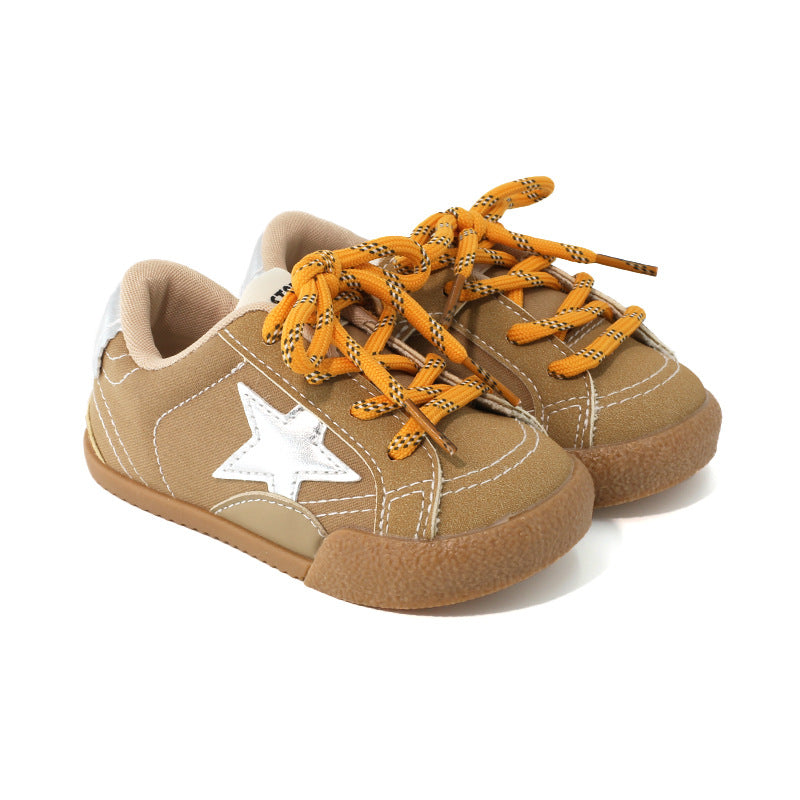 Girls sneakers in tan with orange laces, white star patch, and tan rubber sole