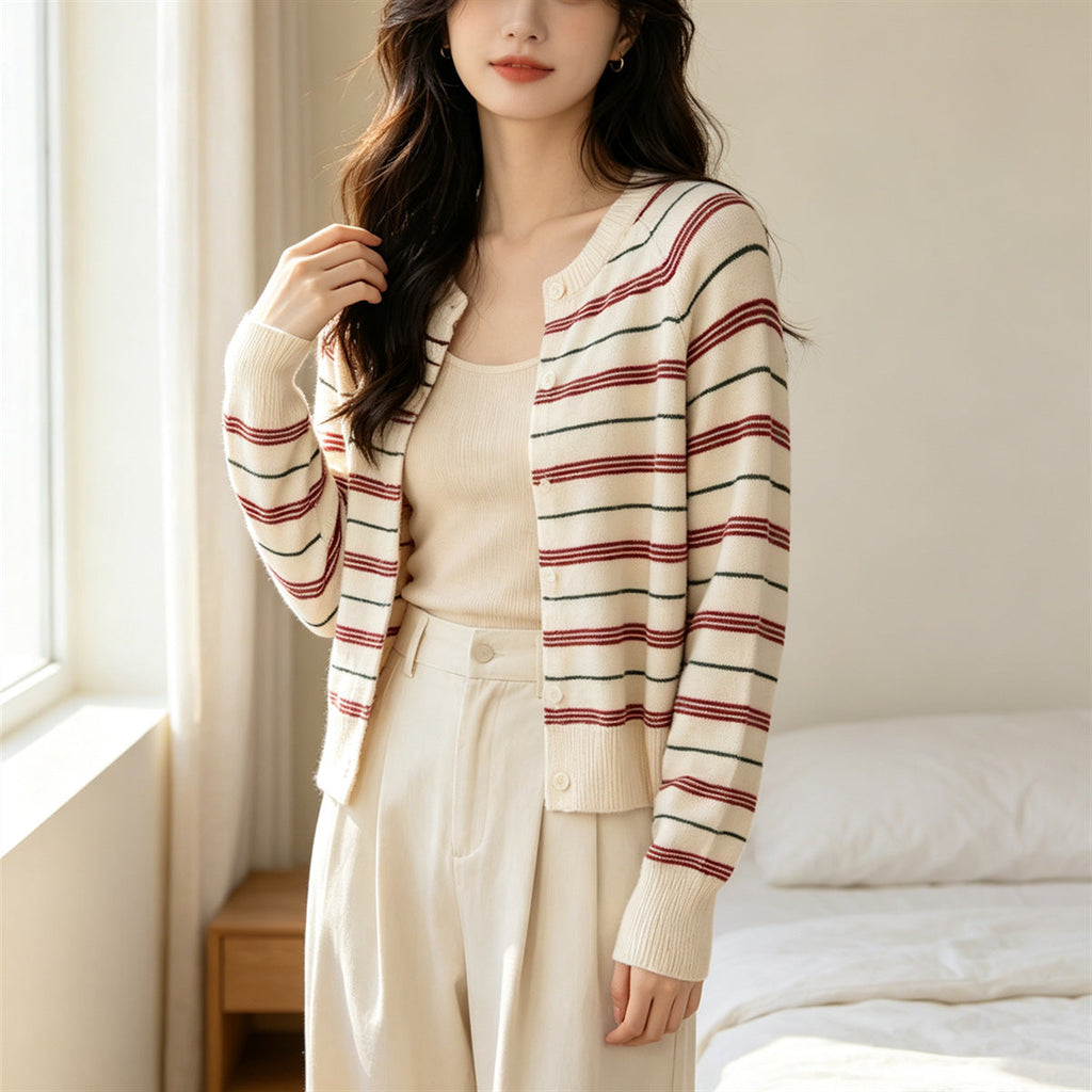 Cream striped cardigan with button front, long sleeves, contrasting red and dark lines