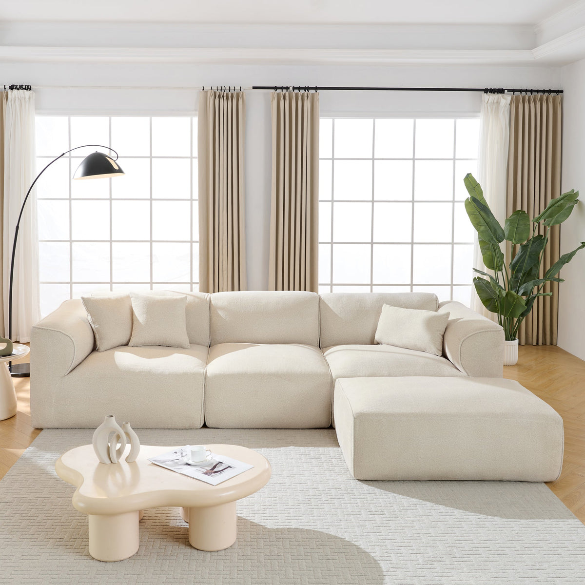 4-seater sectional sofa with detachable footstool in light beige, tufted cushions