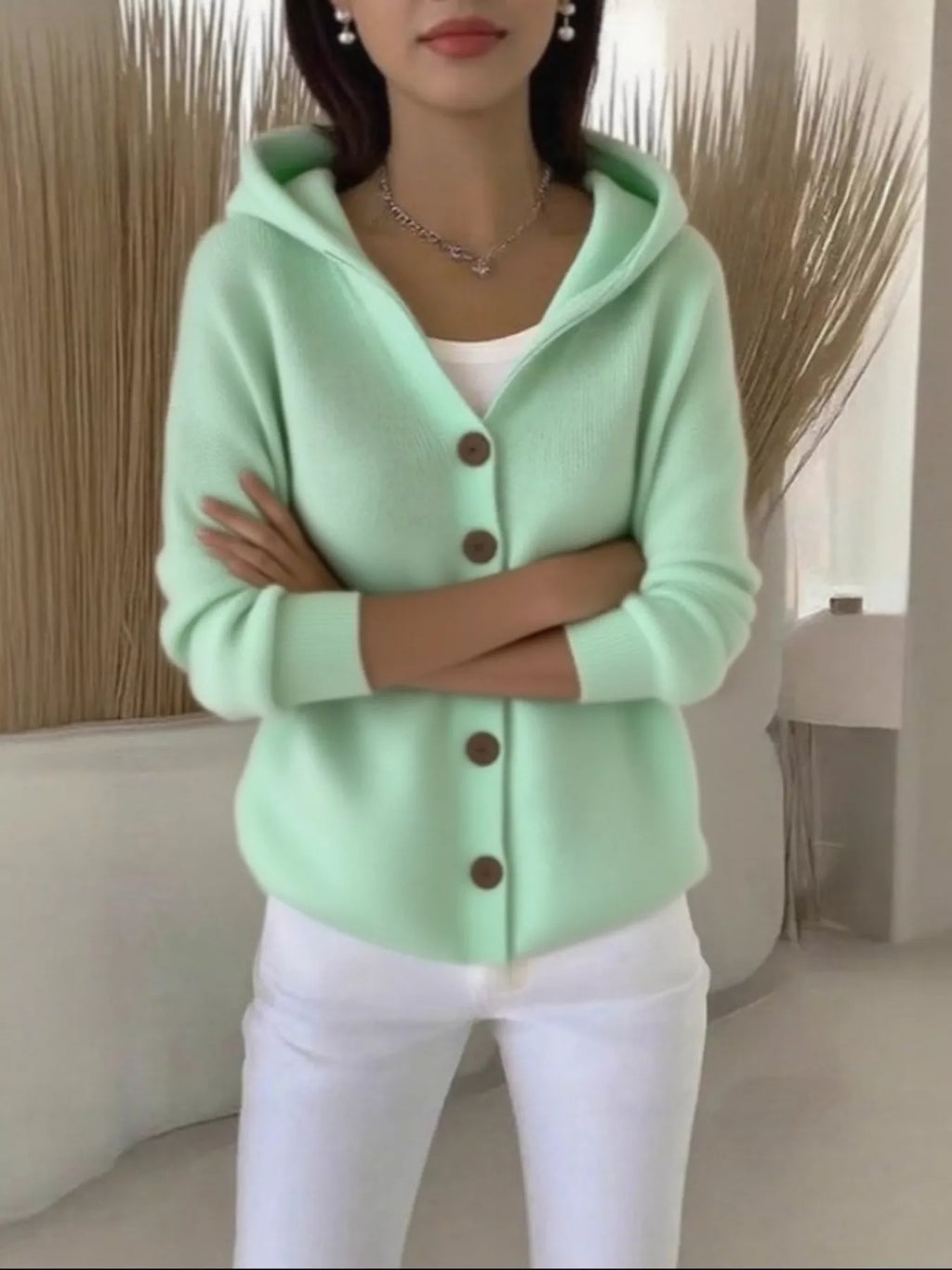 Mint green hooded knit cardigan with button-front closure and relaxed fit