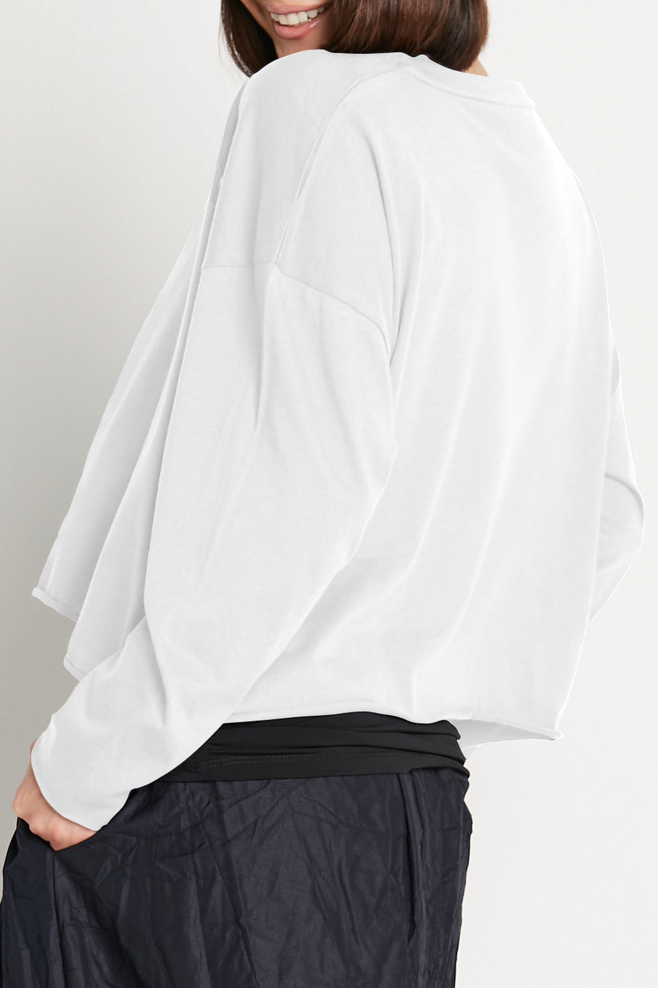 White boxy long-sleeve T-shirt back view, loose drape, crew neck
