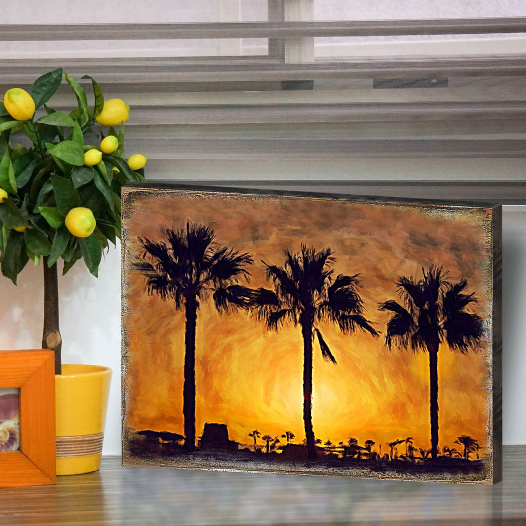 Palm tree sunset wooden wall art with five silhouetted palms on weathered frame