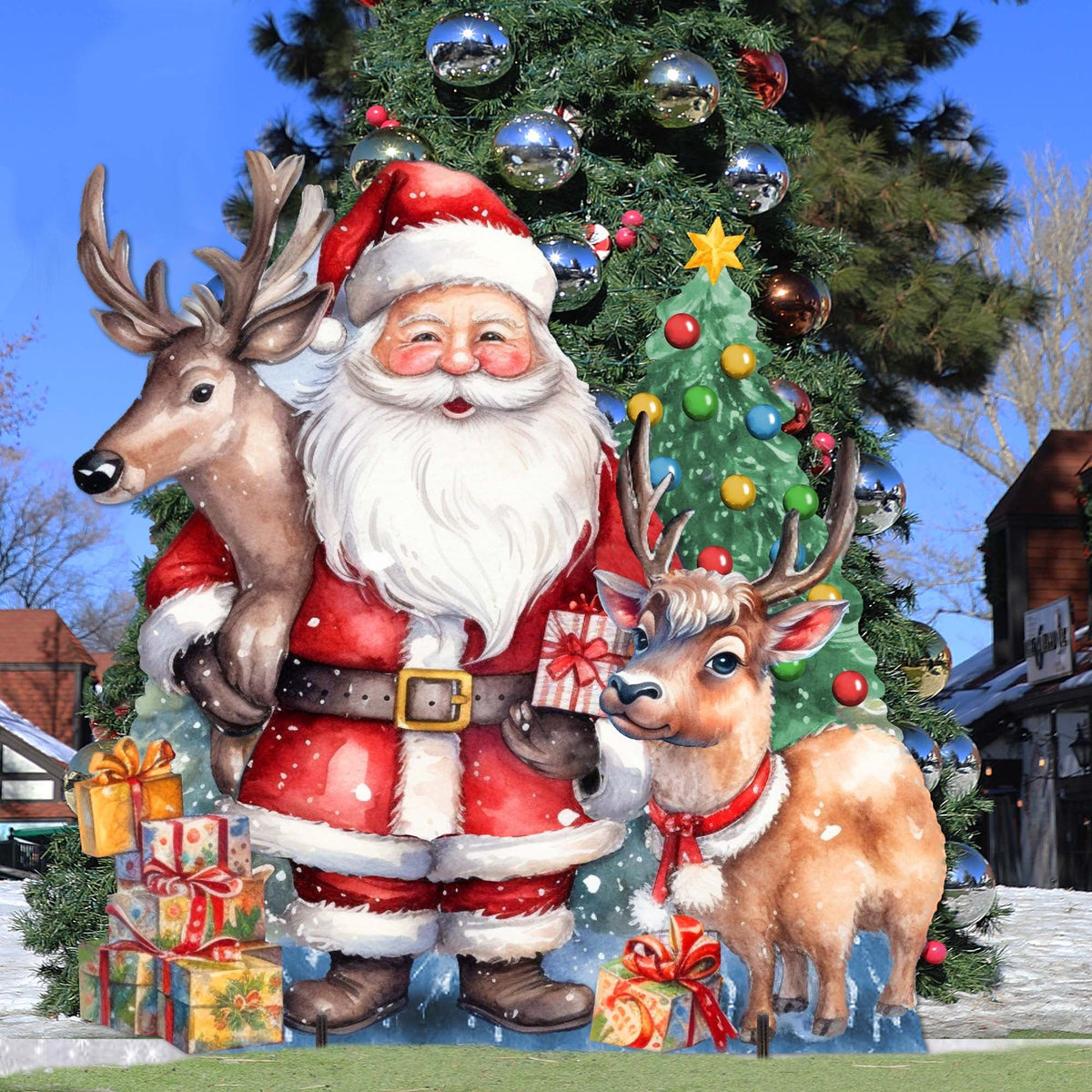 Santa and two reindeer outdoor decor with a decorated Christmas tree and wrapped gifts