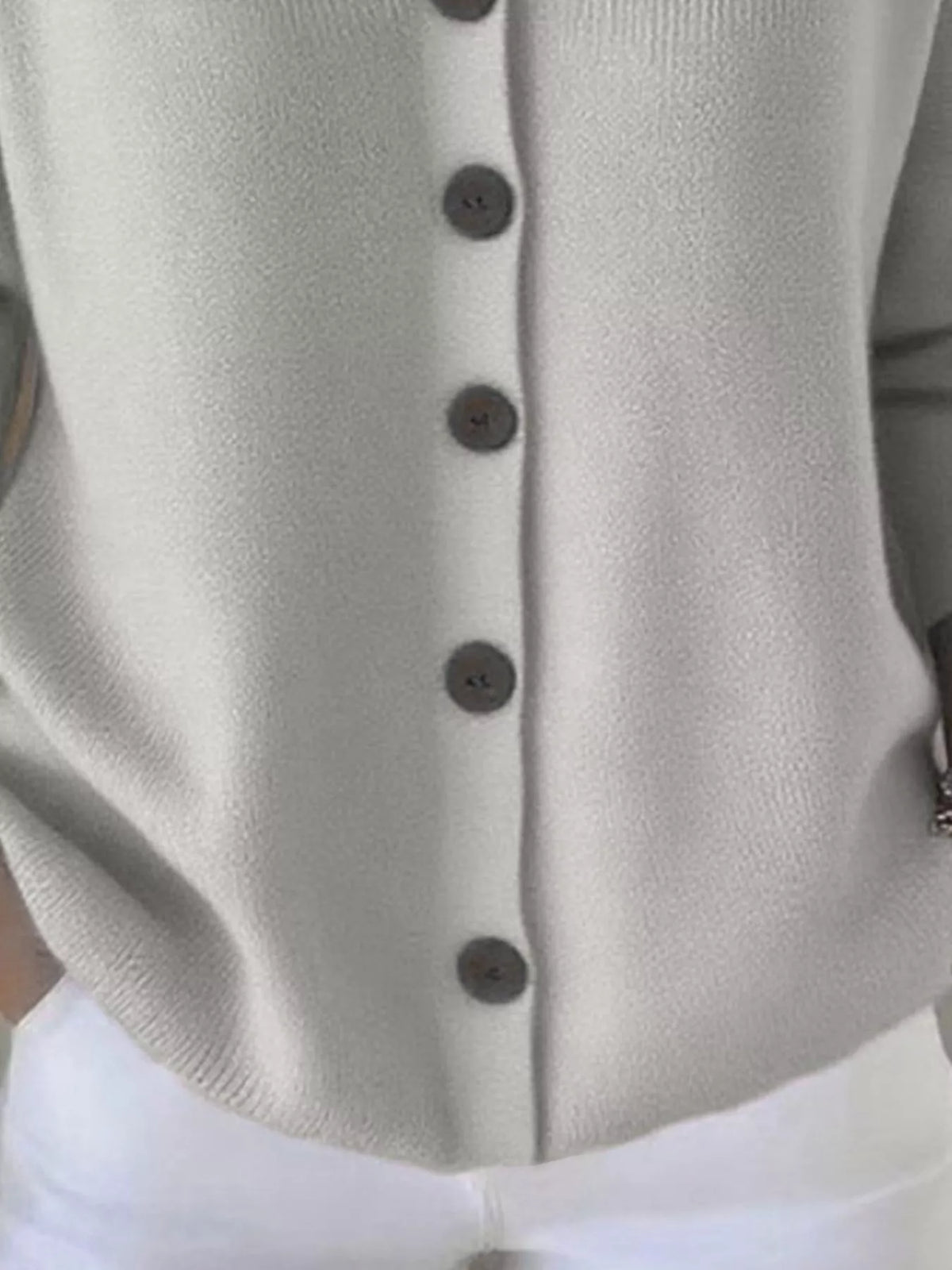 Light hooded knit cardigan front with vertical button placket and ribbed texture