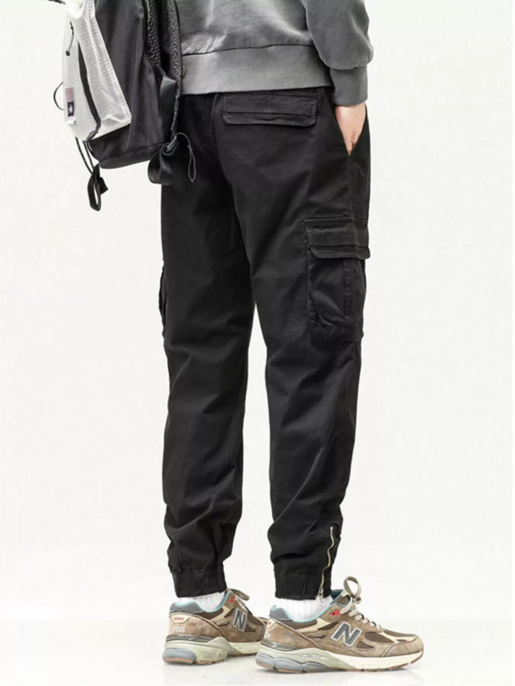 Men's casual cargo pants in black with drawstring waist and cargo pocket panels