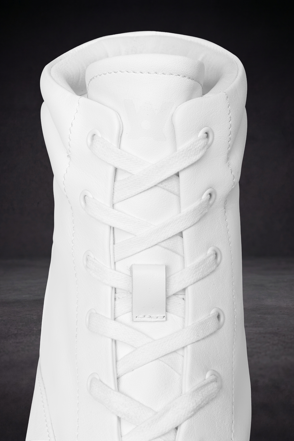 White WOA boot top view with lace-up crisscross and padded collar lining