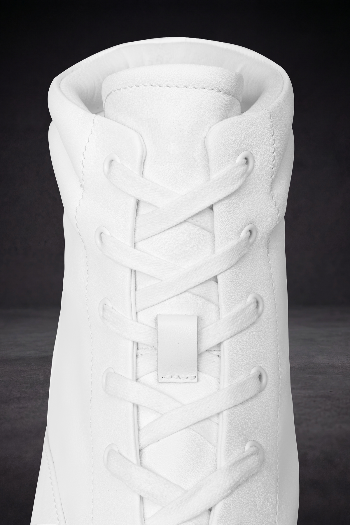 White WOA boot top view with lace-up crisscross and padded collar lining