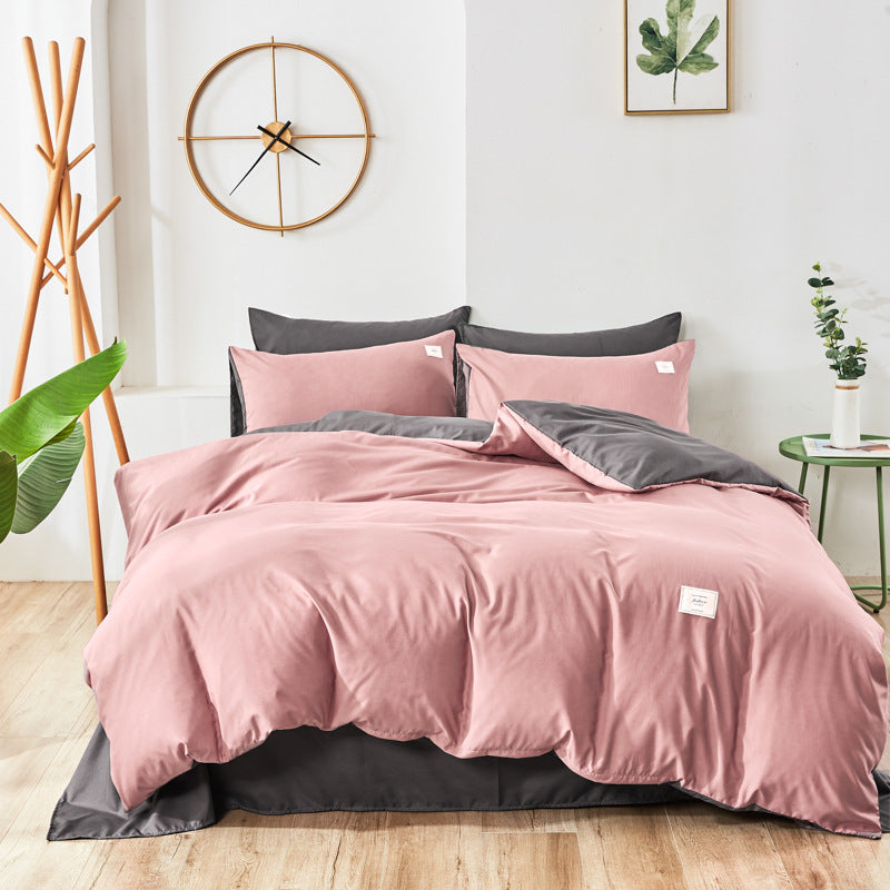 Pink and dark gray bedding set with matching pillowcases and duvet cover