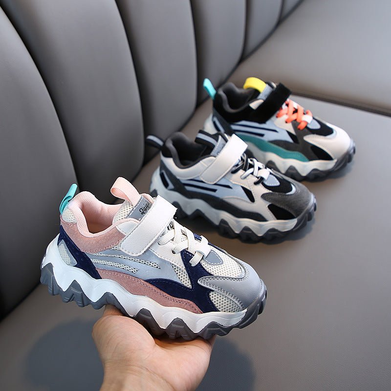 Chunky velcro sneakers in black, white and teal with orange lace accents