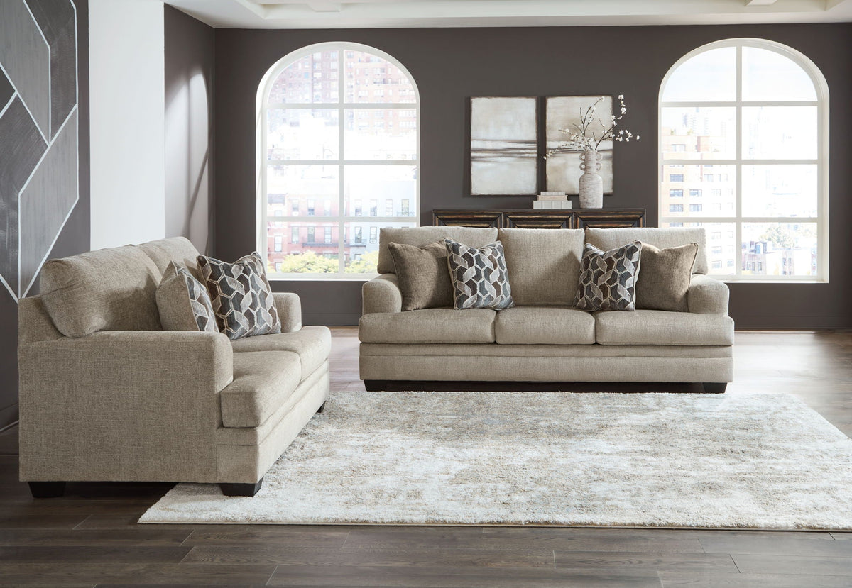 Light brown fabric living room set with sofa, loveseat, and two armchairs
