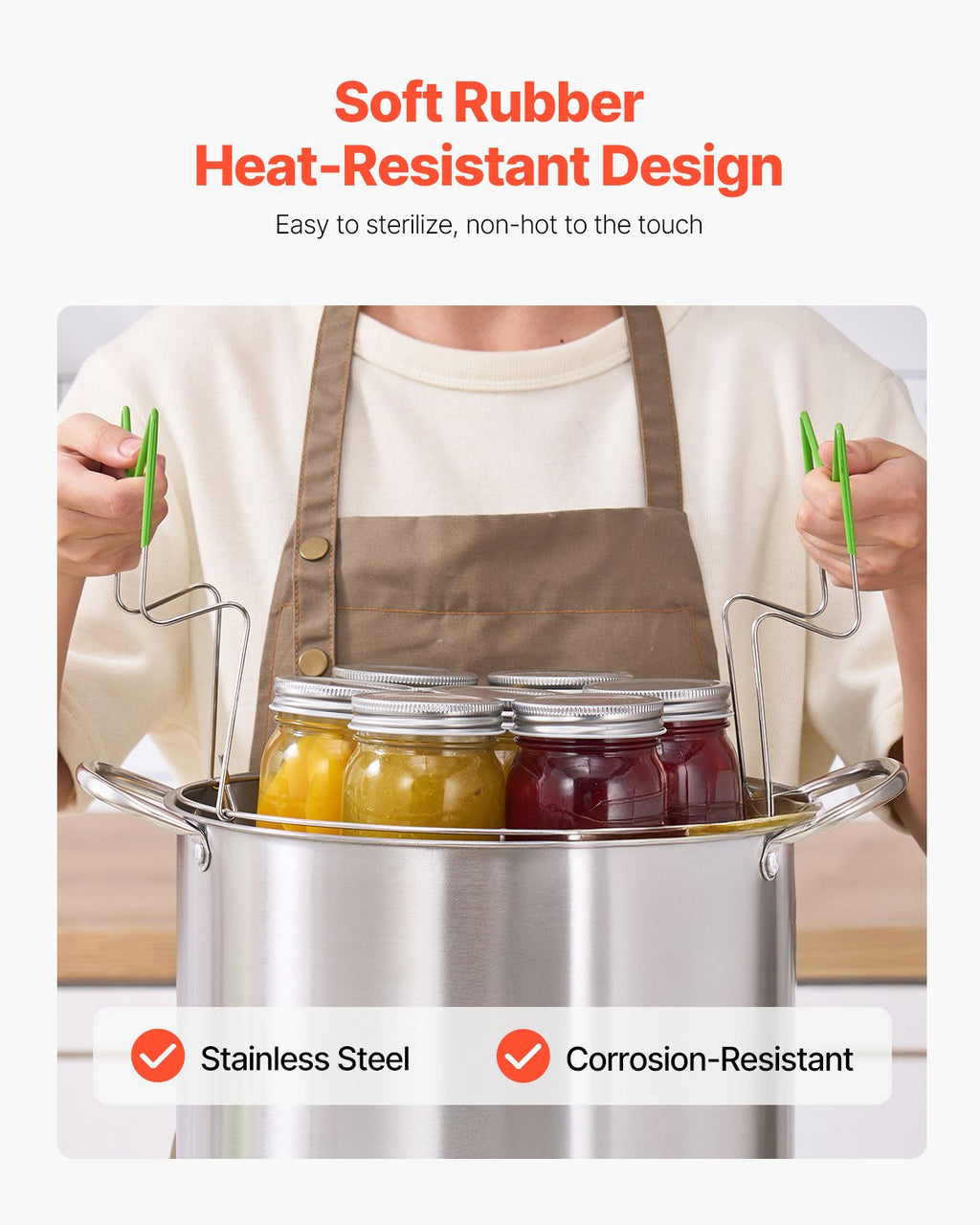 Stainless steel canning pot with jars and green heat-resistant tools