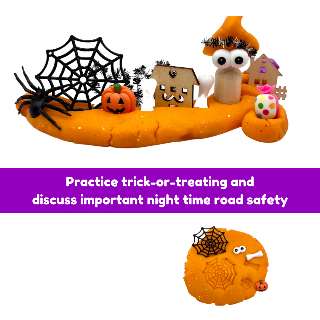 Orange sensory playdough kit tray with Halloween figures and a small jar