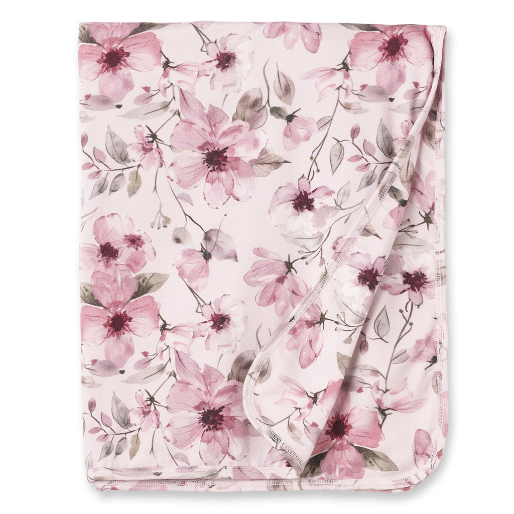 Pink watercolor floral baby stroller blanket, bamboo knit, folded with corner detail
