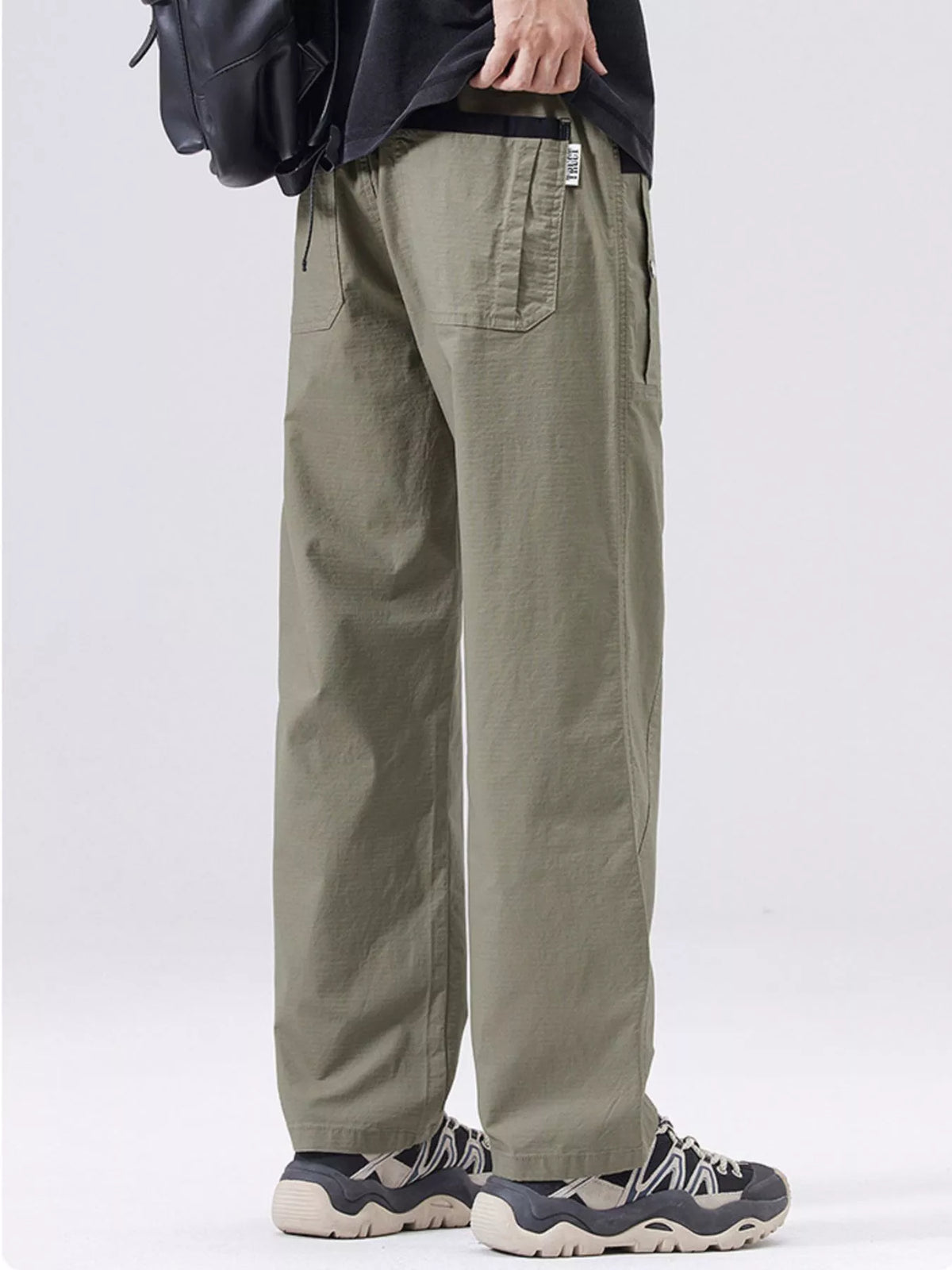 Men's army green cargo pants with front thigh pocket and relaxed straight leg.