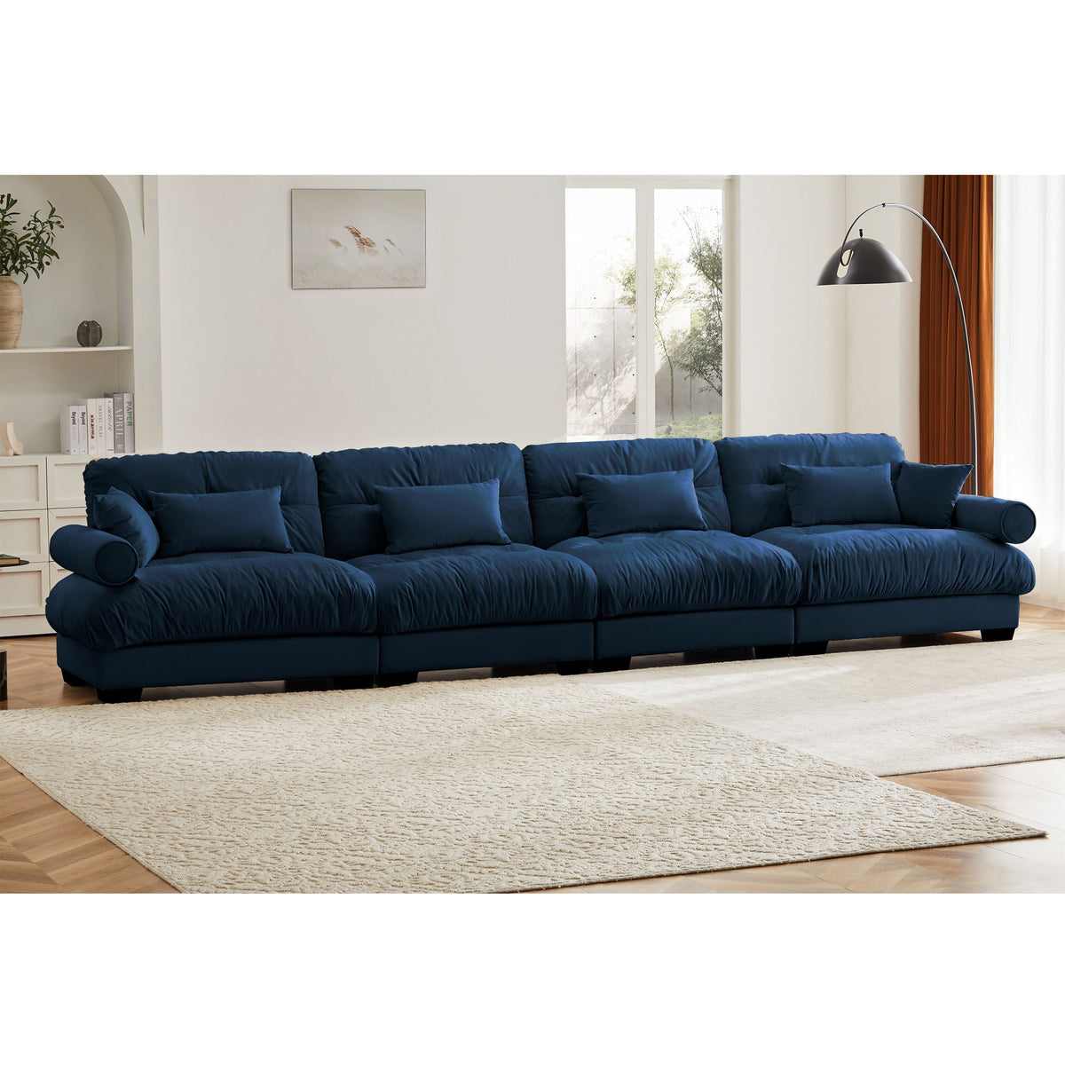 Blue modular L-shaped sectional sofa with deep seats and cushioned back cushions