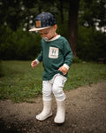 Green bamboo long-sleeve shirt with cream collar and chest pocket, tree print