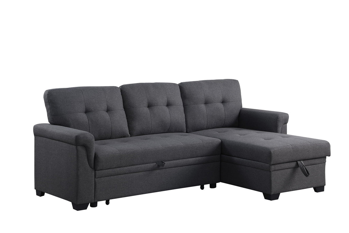 Dark gray sectional sofa with chaise, tufted backrest panels and boxy arm profile.