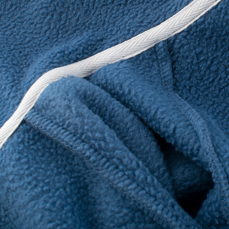 Blue fleece jacket interior lining and white trim close-up