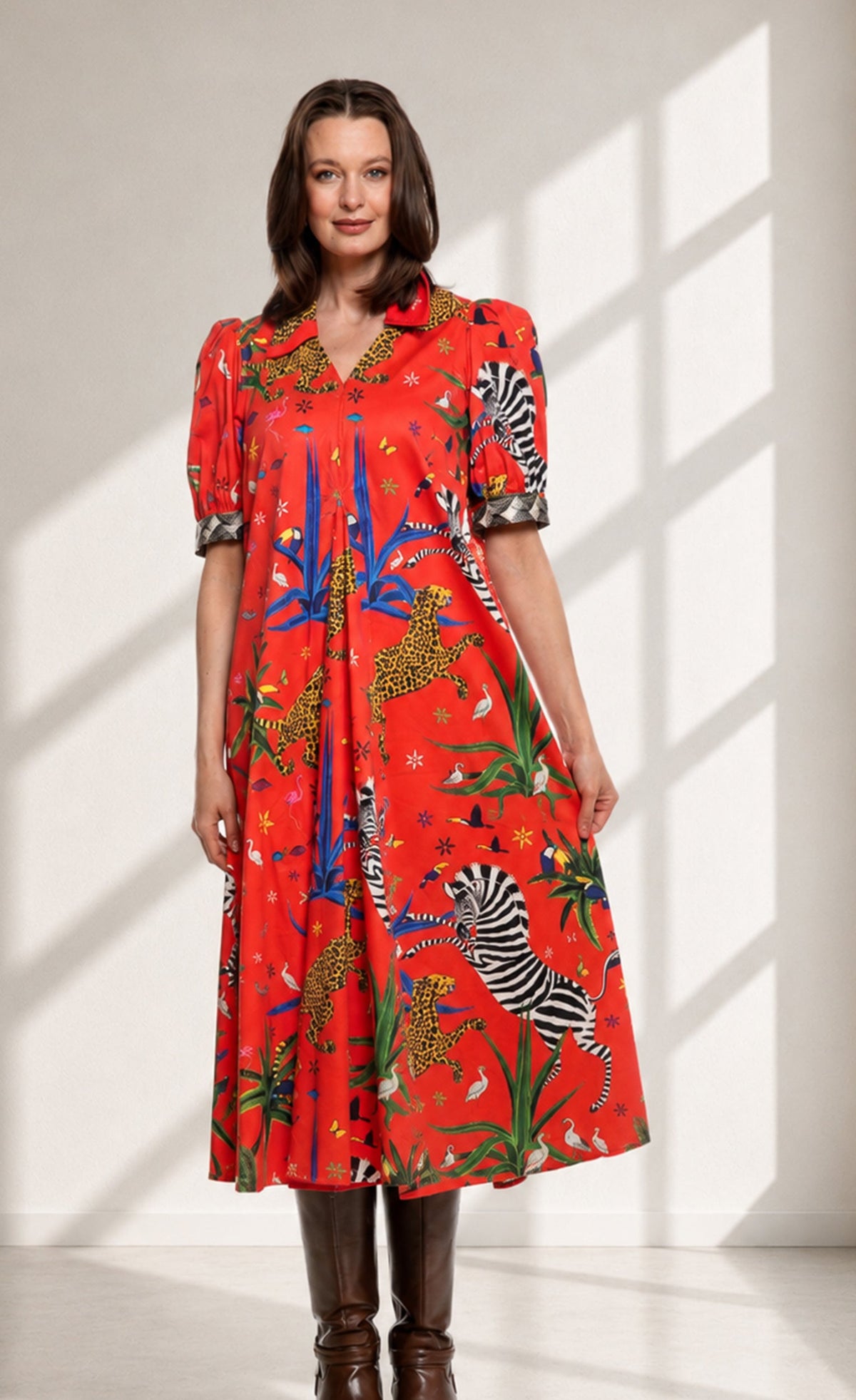 Red printed midi dress with zebra and animal motifs, puff sleeves, V-neck