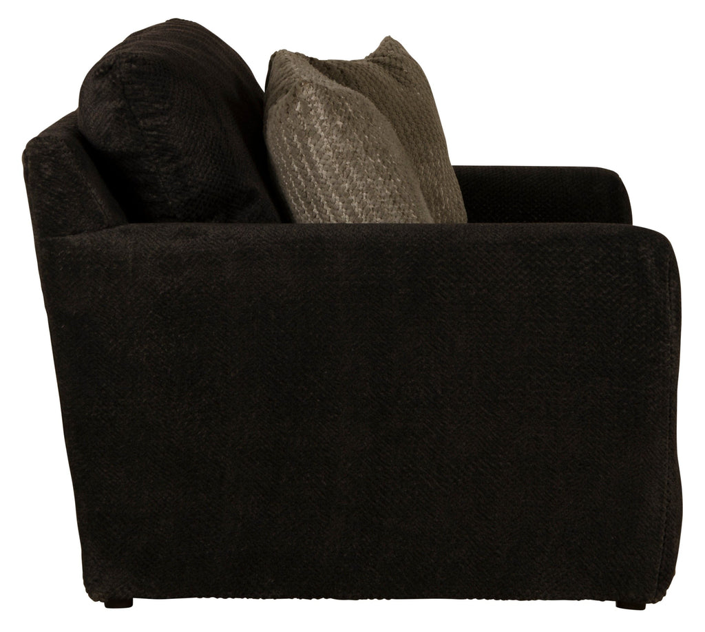 Midwood chair with dark upholstery, rounded arms, and two fabric throw pillows