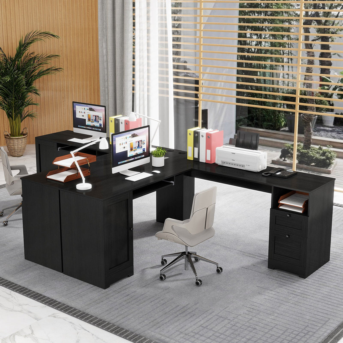 Dark L-shaped computer desk with side drawers and open shelf space for office items