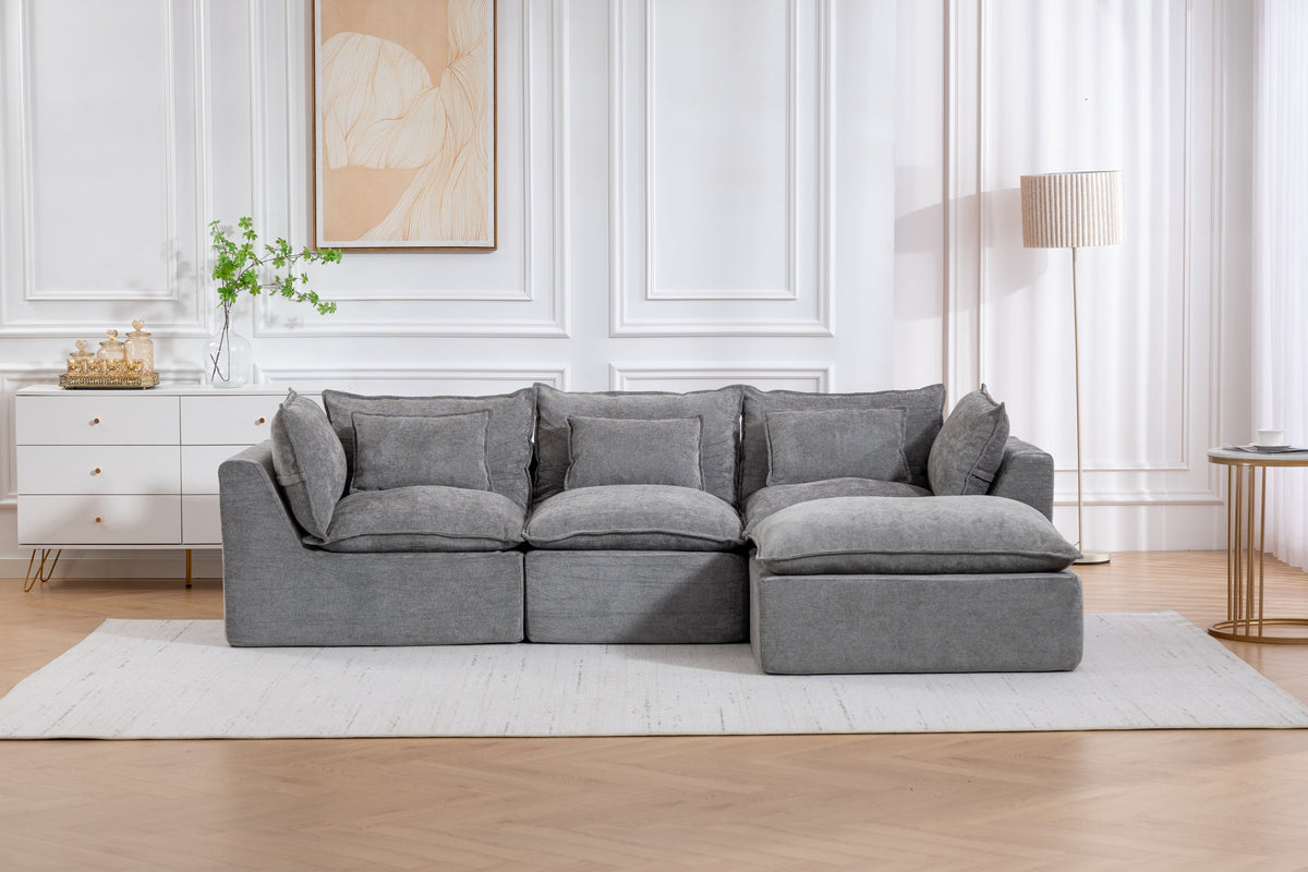 Gray modular sectional sofa with three-seat base and chaise extension