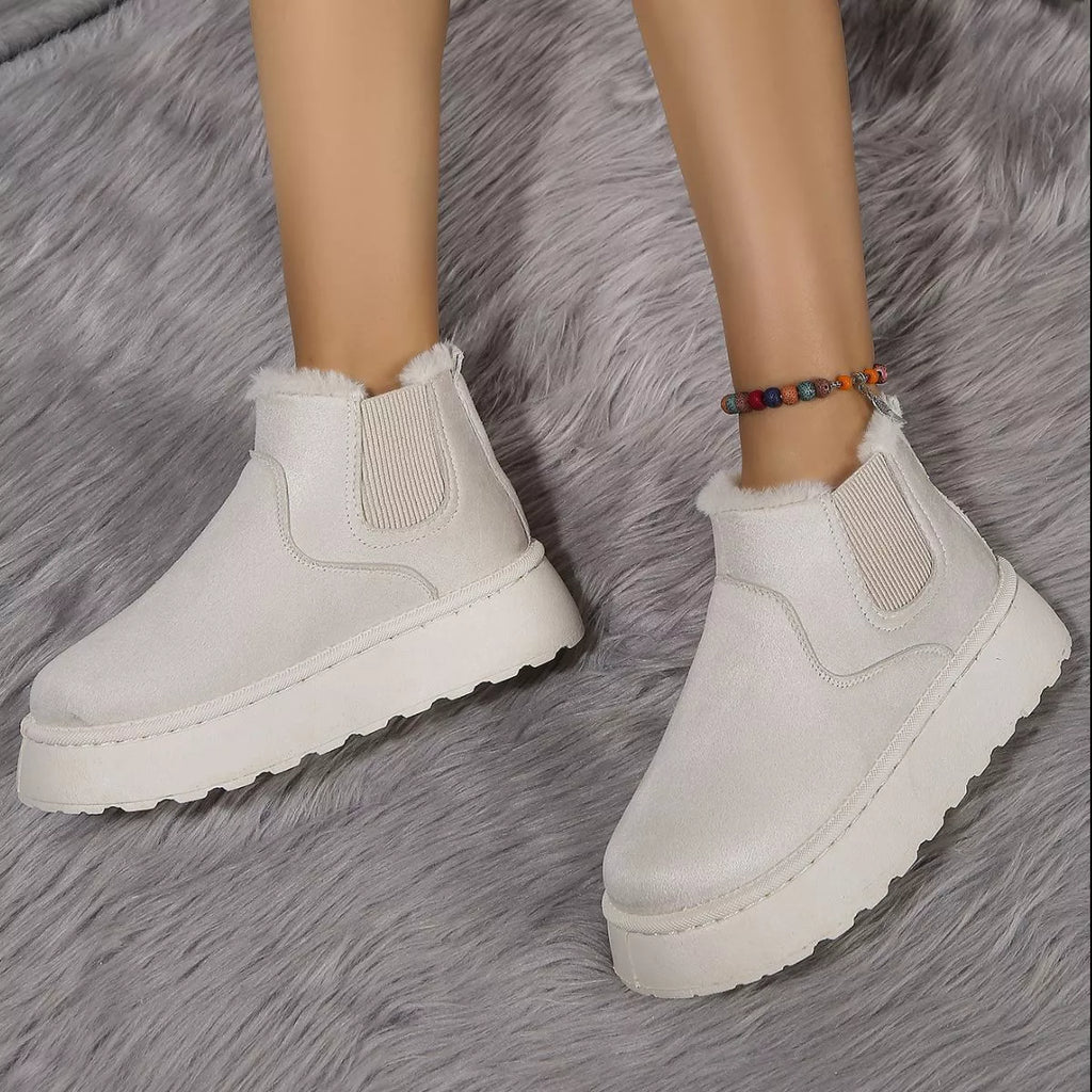 Light beige suede platform ankle boots with round toe, side elastic gore, and thick sole