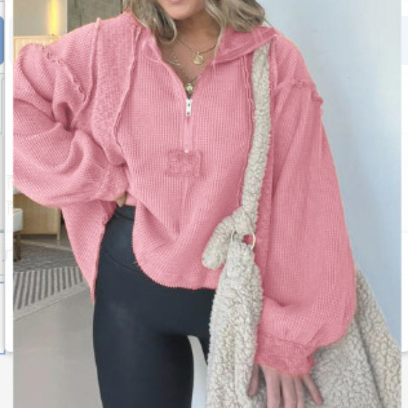 Pink quarter-zip sweater with textured knit and contrast rope trim with frayed accents