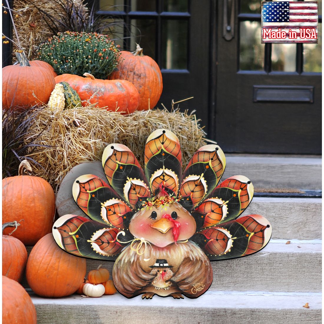 Turkey door hanger decor with orange-and-black feather fan and pink head, beak open