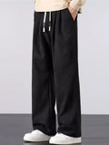 Men's black wide-leg drawstring pants with elastic waist and side pockets