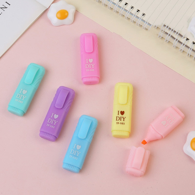 Pastel mini highlighters labeled "I♡DIY" with caps and chisel tips, assorted colors.