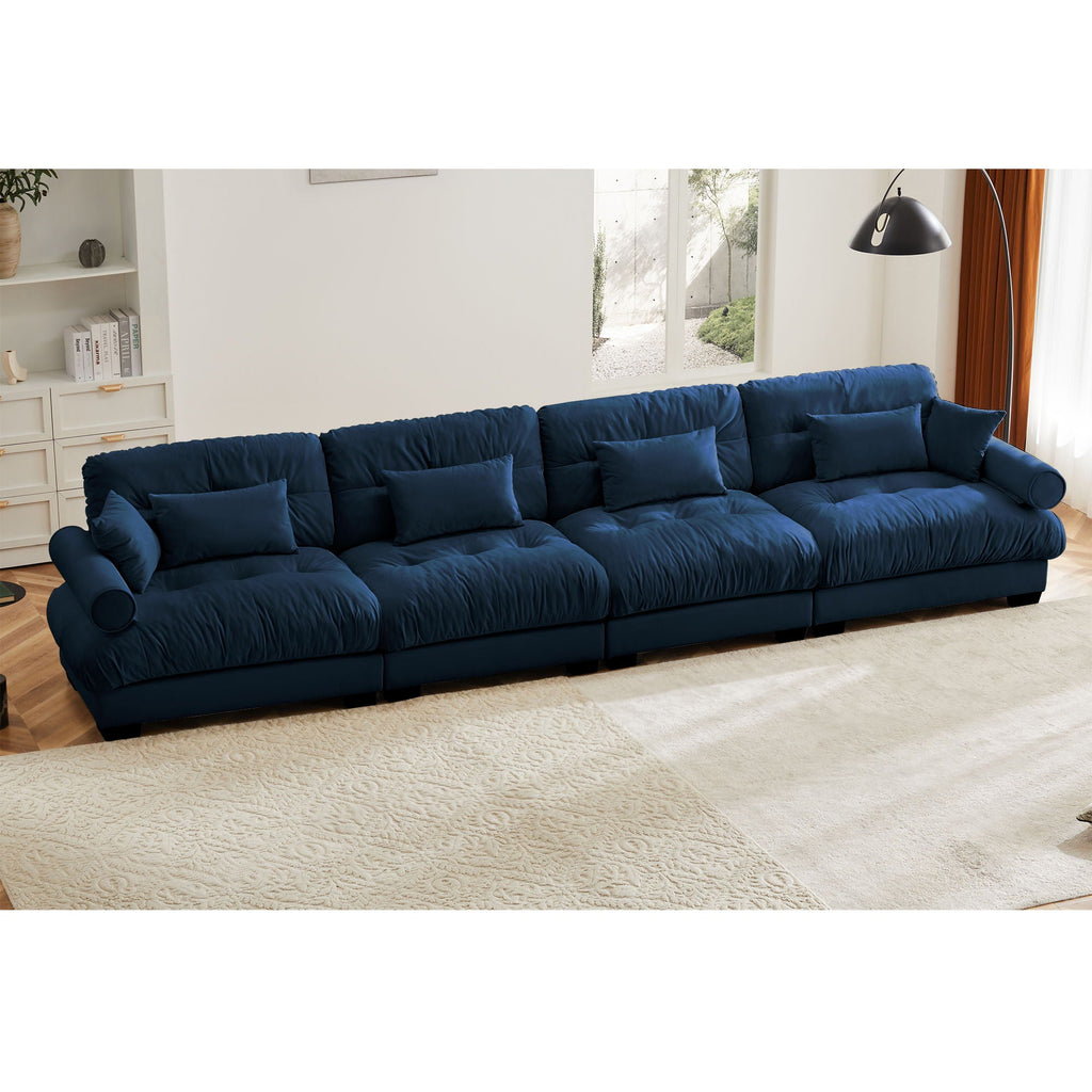 Blue modular L-shaped sectional sofa with deep seats and rounded bolster arm