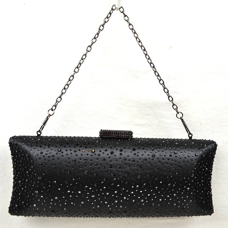Black studded crystal clutch bag with top clasp and silver chain shoulder strap