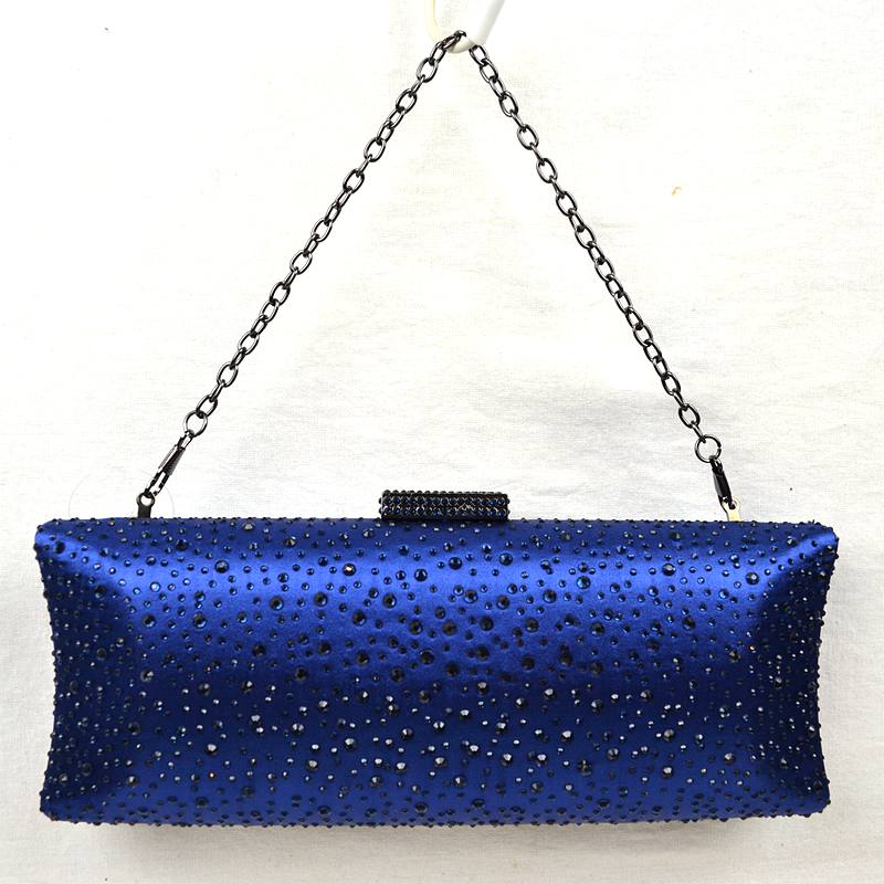 Blue studded crystal clutch bag with top clasp and silver chain shoulder strap