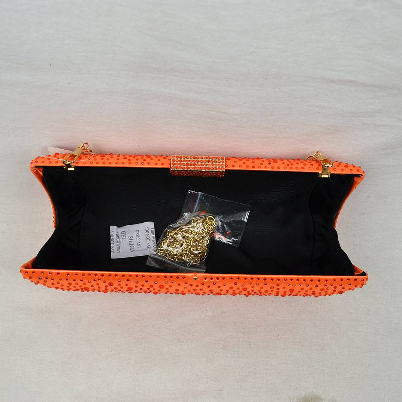 Orange studded crystal clutch bag open view with black lining and included items