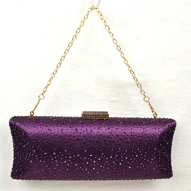 Purple rhinestone-studded evening clutch with gold chain handle and rectangular clasp