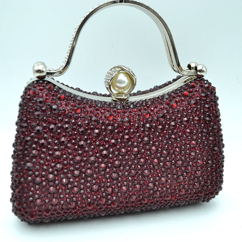 Rhinestone evening clutch bag with pearl clasp and curved metal handle, burgundy
