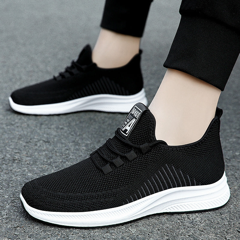 Black mesh lace-up sneakers with thick white midsole and cushioned collar