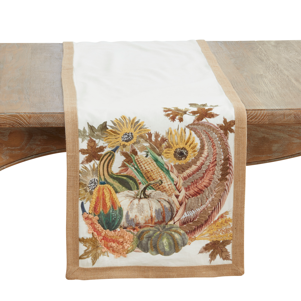 Embroidered harvest-themed table runner with multi-color cornucopia and floral border